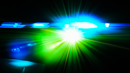 Realistic Len flare glow light effect on black background. Optical flares overlay or screen filter matte.の写真素材