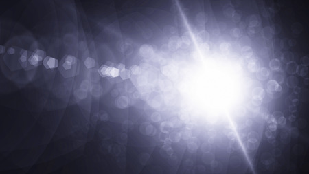 Realistic Len flare glow light effect on black background. Optical flares overlay or screen filter matte.の写真素材