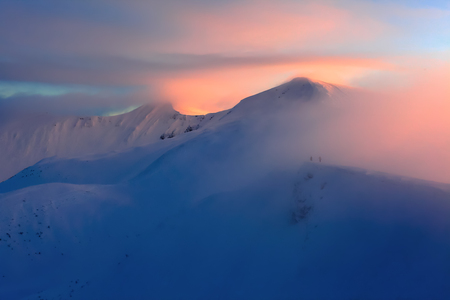 Unbelievable evening on the snowy hill from the life of free- rider. The mountains are in snow.  Unbelievable winter landscape.の写真素材