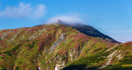 The abandoned, old building, the observatory, on the top of the high mountains, covered with fog.の写真素材
