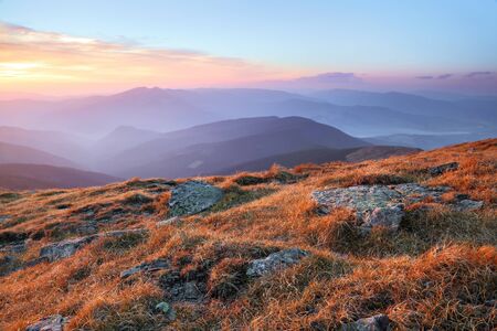 Panorama with interesting sunrise enlightens surroundings. Landscape with beautiful mountains and stones. Fantastic autumn rural scenery. Touristic resort Carpathian national park, Ukraine Europe.の写真素材