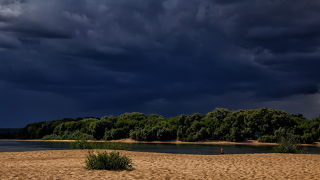 stormy dark sky on the lakeの写真素材