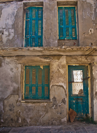the old building with shutters on the Windows on the street Rethymno Creteのeditorial素材