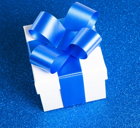 Gift box with blue ribbonの写真素材
