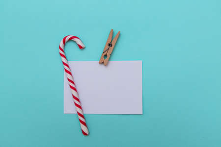 white sheet for an inscription and a New Year's gift on a blue backgroundの写真素材