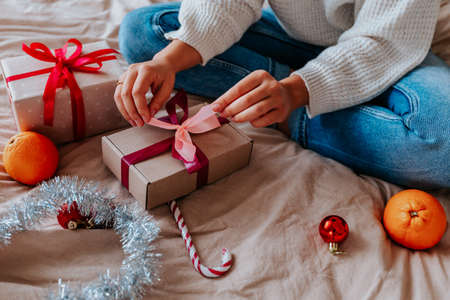 person holding christmas gifts