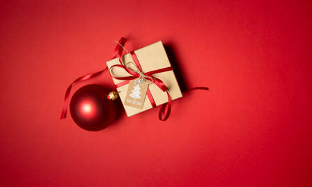 christmas gift box on the red background. High quality photoの写真素材