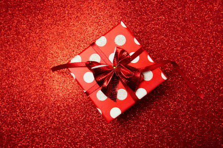 polka dot gift box on red background, happy valentines day . High quality photoの写真素材