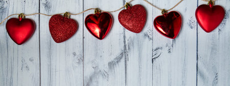 red hearts on a wooden background. valentines day banner. High quality photoの写真素材