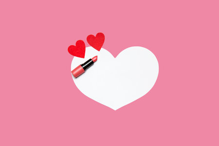 lipstick and small hearts on a pink-white background. High quality photoの写真素材