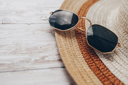 summer hat and sunglasses. summer and tourism concept, beach holiday items. High quality photoの写真素材