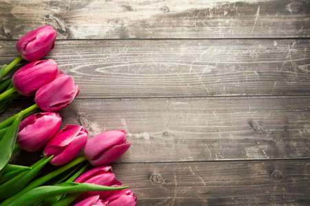 Spring tulips flowers on a old wooden background. High quality photoの写真素材