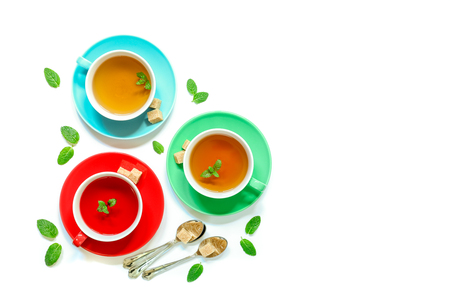 Tea Collection of three different types of tea - mint, hibiscus and herbal tea in cups isolated on white.の写真素材