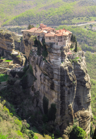 Meteora monasteries. Beautiful morning view on the Holy Monastery of Varlaam placed on the edge of high rock. Kastraki, Greece. March 2017. Vertical.の写真素材
