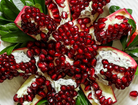 Ripe broken pomegranate fruit or pomegranate seeds background. Top view. Close-up.の写真素材