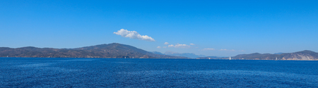 Beautiful seascape. Taken from the yacht on a sunny summer day. Saronic Gulf Greece.の写真素材
