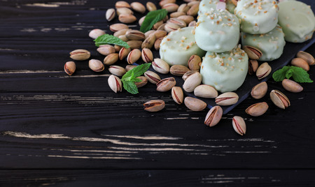 Pistachio ice cream pop on wooden tableの写真素材