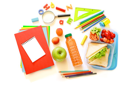 School supplies and lunch box with sandwiches, pieces of cucumbers and carrots, apricot, cherries,...
