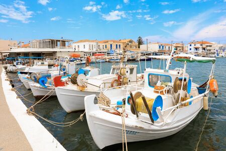 Sunny summer day and beautiful fishing boats in the port of Elafonisos village island, Laconia,...