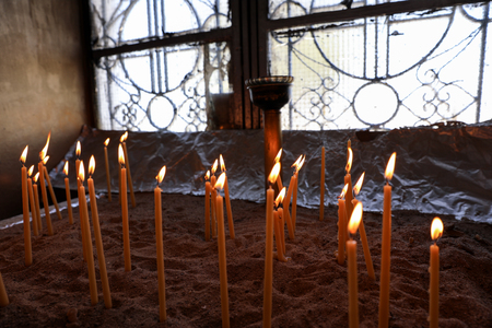 Many burning wax candles in the Saint Georges chapel, Mount Lycabettus, Athens, Greece.の写真素材