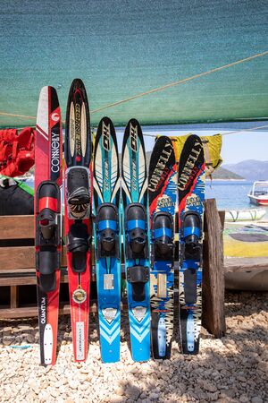 August 11th, 2019. Various of water skis and wake boards on the Antisamos beach, Sami Kefalonia, Greece. Summer water sports activities concept. Vertical. Daylight.のeditorial素材