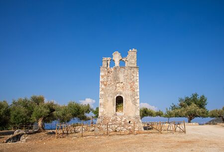 Summer sunny day the old bell tower of the Monastery of Argilion in the open territory for tourist visits.の写真素材