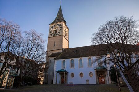 Zurich, Switzerland-December 19th, 2019. St. Peter Church Evangelical-Reformed Church of the Canton of Z rich member of the Federation of Swiss Protestant Churches as seen from St.Peterhofstatt plaza.の写真素材