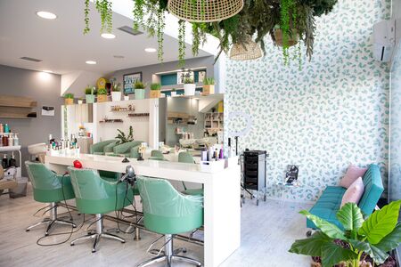 ATHENS, GREECE - FEBRUARY 18, 2020: Modern beauty salon interior design in white and aqua green colors. Horizontal.のeditorial素材