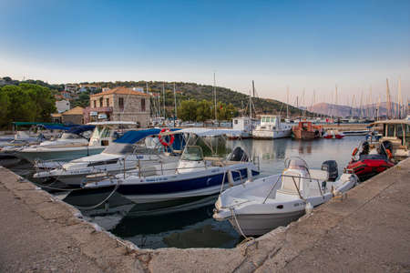 KASTOS island, GREECE-August,2019: Port of Kastos island with moored boats - Ionian sea, Greece in summer.のeditorial素材