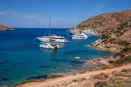 Yachts anchored off the coast of Kythnos island, Kolona beach, Cyclades-Greece.のeditorial素材