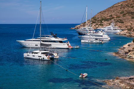 Yachts anchored off the coast of Kythnos island, Kolona beach, Cyclades-Greece in June, 2021.のeditorial素材