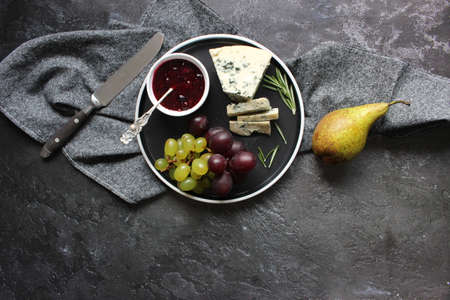 blue cheese and fruits. beautiful table setting.の写真素材