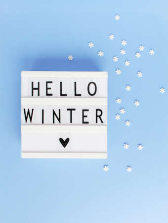 Hello winter inscription. Creative background. Copy space. Flat lay concept.