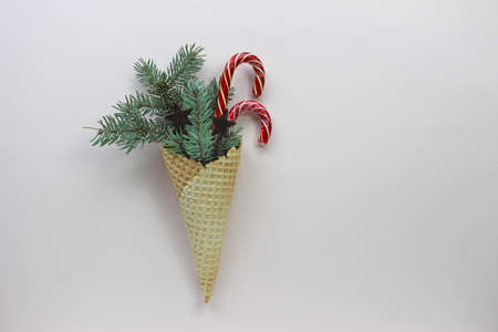 New Year Christmas holiday party celebration waffle cone candy canes fir tree branch copy space...