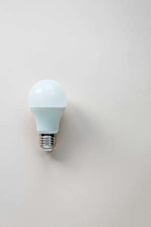 Energy-saving and eco-friendly life. Creative top view flat lay of LED light bulbs composition with copy space in minimal style.の写真素材