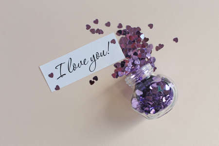 colored confetti falling out of glass bottle, holiday decorの写真素材