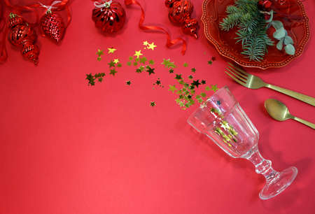 Confetti in the shape of stars poured out glasses. Christmas and new year background. Top view.の写真素材