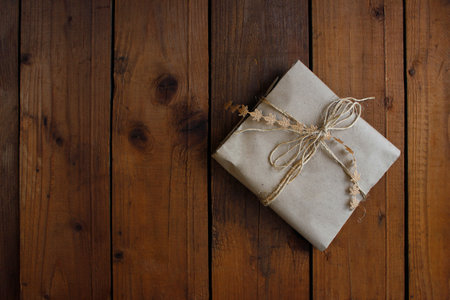 Christmas gifts on wooden background top view. Flat lay