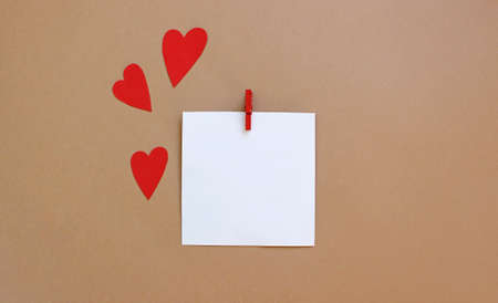 Red hearts background, paper cut romantic concept, top view. flat lay composition. Valentines Day greeting card concept. Mothers Day anniversary design.の写真素材