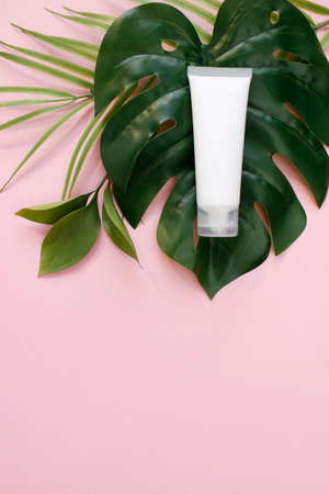 Mockup white plastic tube for moisturizer, lotion, facial cleanser background top view. Delicate purity skin care productの写真素材