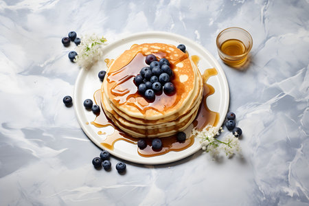 Blueberry pancake on a marble surface, top view. Homemade sweet pastries.の素材