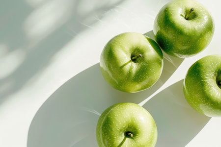 Green apples on a light background with copy spaceの素材