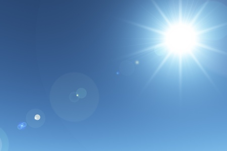 Sun lens flare with sky backgroundの写真素材