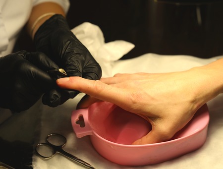 Coating gel varnish photography close-up.manicure in the salon.の写真素材