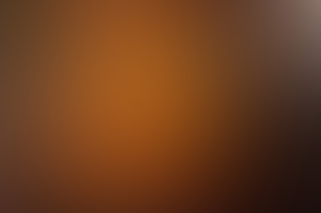 brown blurred background. dark orange background gradient.の写真素材