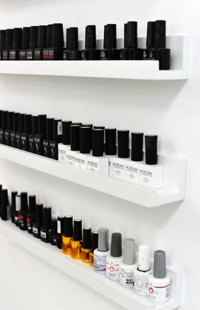 gel nail polish kiemi. Nail polishes are on the shelf. gel for nails polishes bottles, are in the window of the manicurist.のeditorial素材