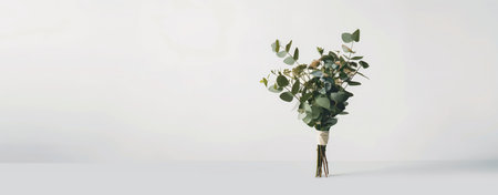 Elegant bouquet of fresh eucalyptus leaves against white backdrop. natural beauty and tranquility in home decor and events. Marketing materials and websites. Commercial advertising. beautiful bouquet, professional florist. eucalyptus leaves the bouquet is standing. white background.の写真素材