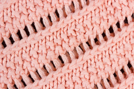 Texture of coral knitted woolen fabric close up.の写真素材