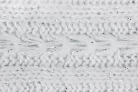 Textured background of white knitted wool sweater.の写真素材