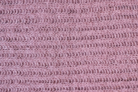 Texture of knitted pink scarf.